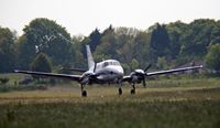 Beech 90 Taking Off