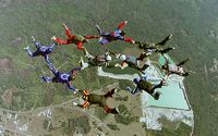 Ten Skydivers In Formation